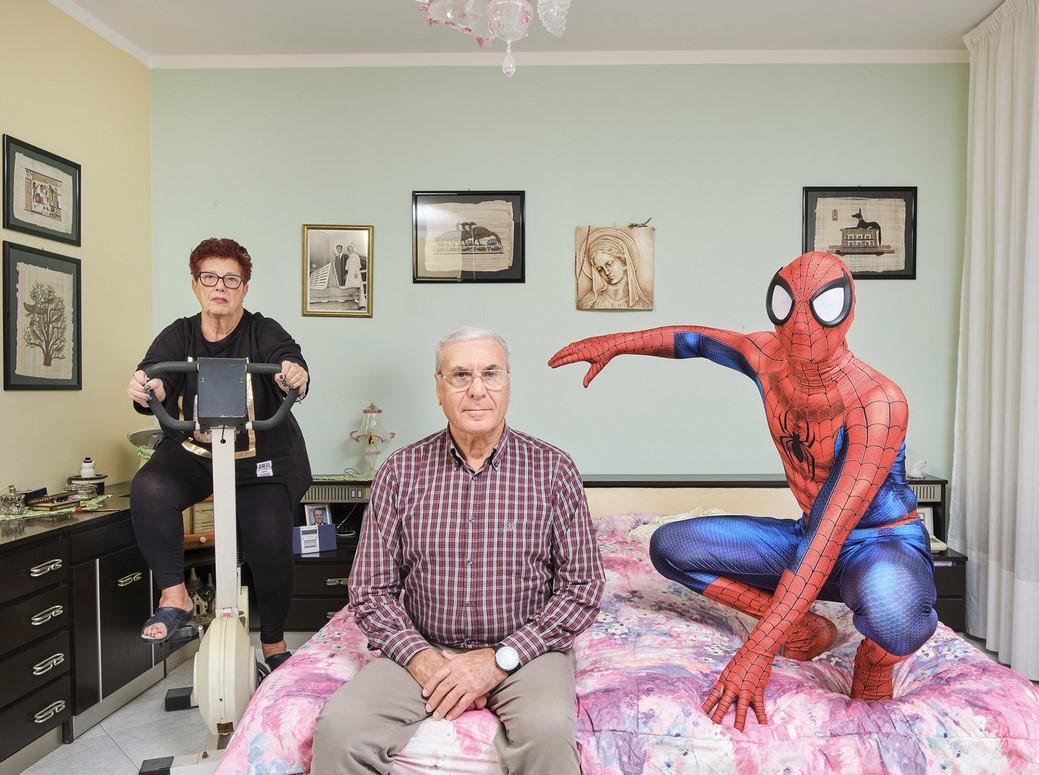 Manuel (28) poses with his grandparents in their bedroom in Livorno, Tuscany, Italy. ���� � ���� niccolorastrelli.com